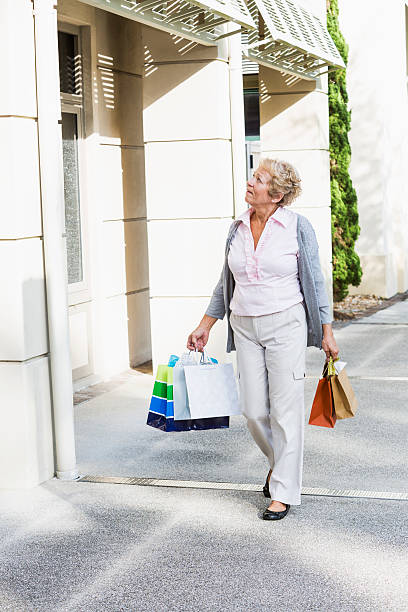 istock Senior woman shopping 465854611