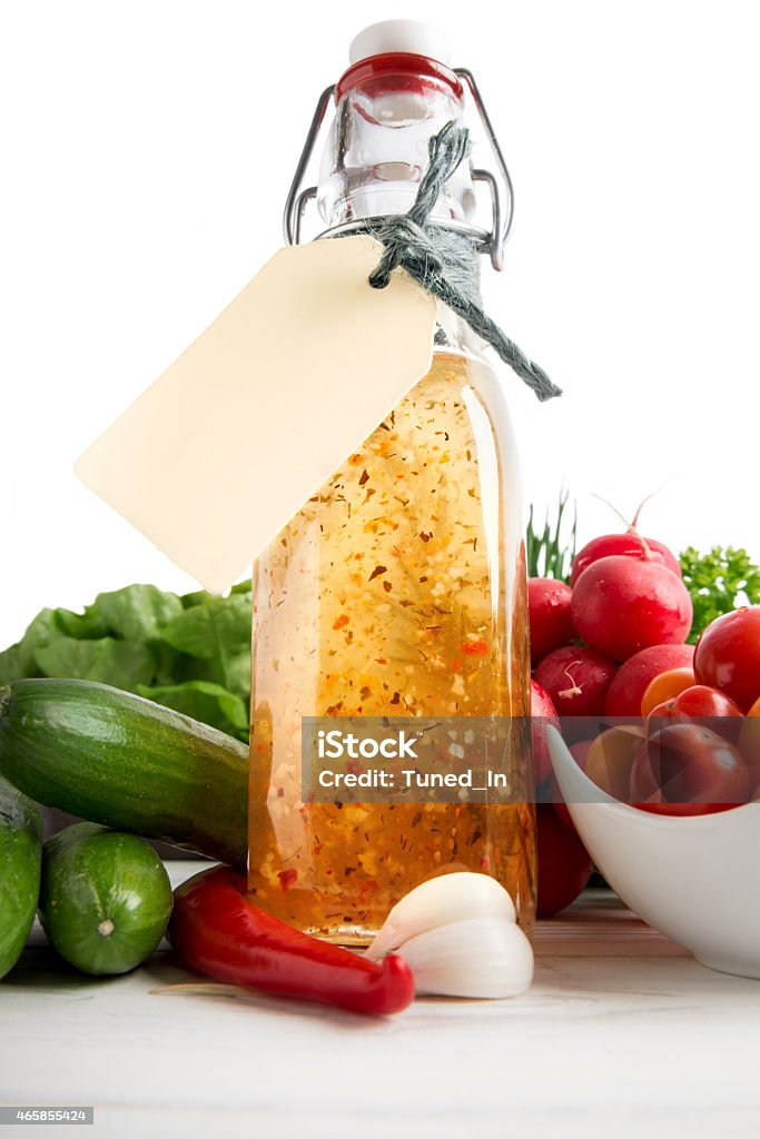 Homemade herb dressing in bottle and salad ingredients 2015 Stock Photo
