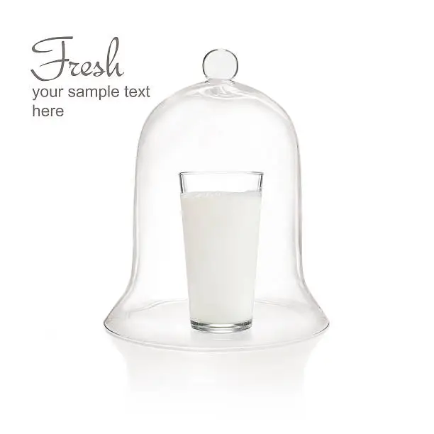 Glass of milk under bell jar