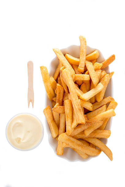 French fries and mayonnaise in bowl stock photo