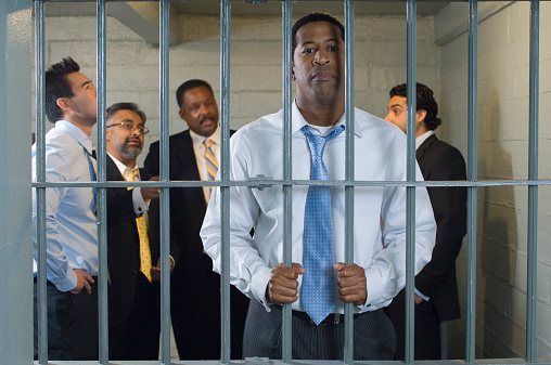 Group of men in prison cell
