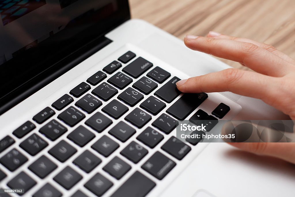 Hands typing on laptop keyboard Female finger typing on computer keyboard 2015 Stock Photo
