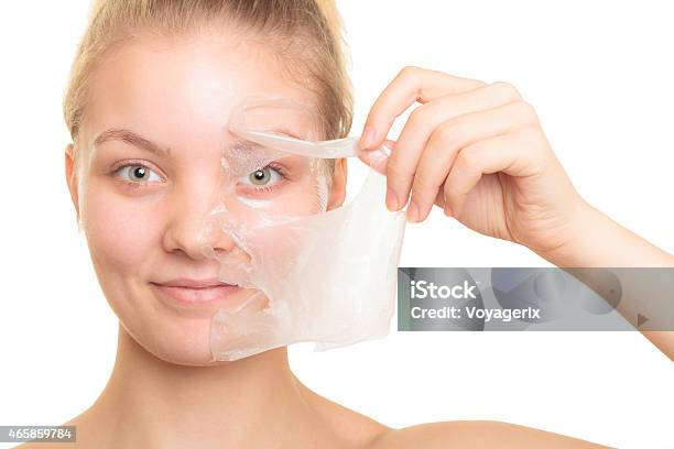 Girl Removing Facial Peel Off Mask Stock Photo - Download Image Now - Peel - Plant Part, Facial Mask - Beauty Product, Mask - Disguise