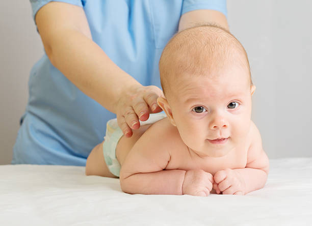istock Little baby with doctor 465860616
