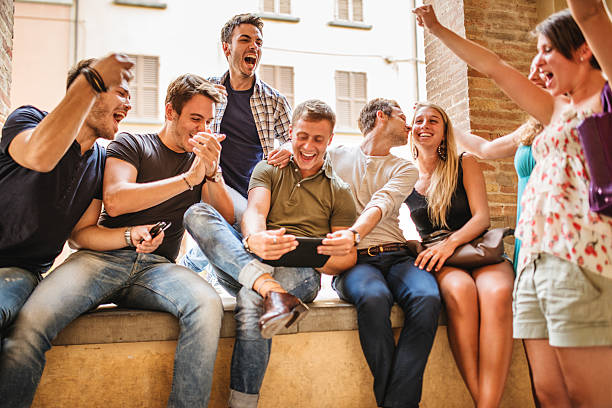 istock Group of people enjoying together with a tablet 465864890