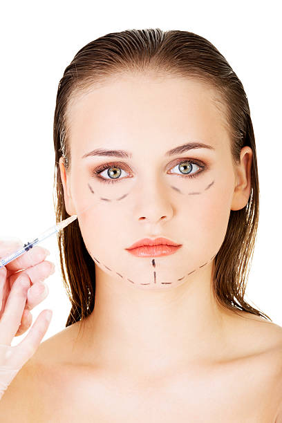 istock Cosmetic botox injection in the female face 465869319
