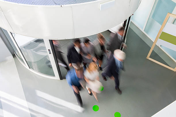 istock Group of ofiice worker entering through revolving door 465869440