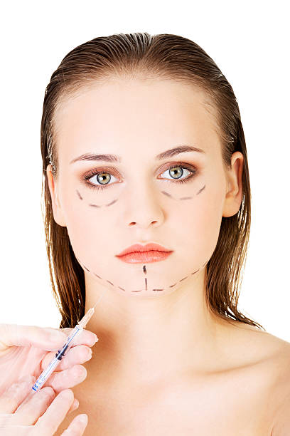 istock Cosmetic botox injection in the female face 465870529