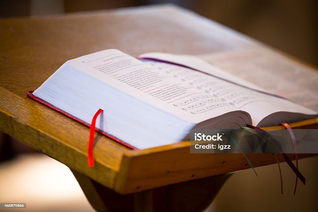 Open bible on table with bookmarks in pages Bible on the church pulpit. Pulpit Stock Photo