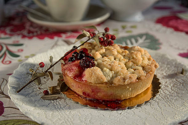 istock Delicious homemade cherry pie on floral tablecloth 465873280