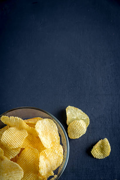 istock Potato chips in the glass bowl 465873442