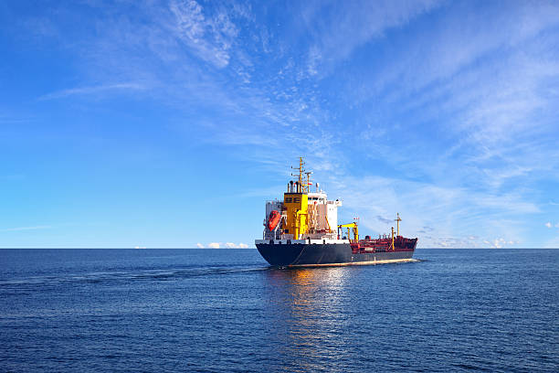 istock Tanker ship on water with blue sky  465874294