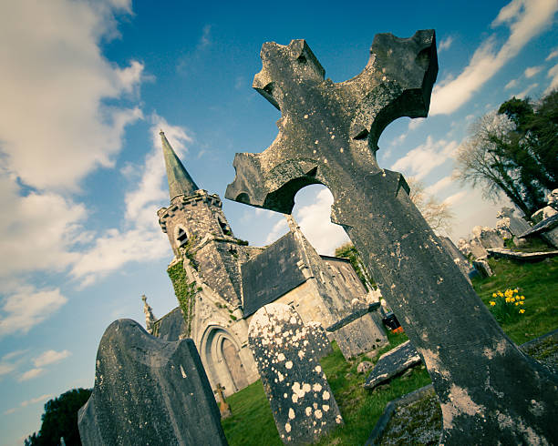 Crucifix grave marker at abandoned Castlehyde church and cemetery in Cork Ireland