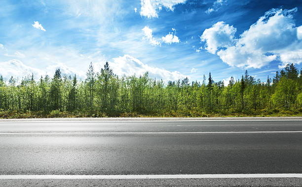 istock Side view of asphalt road and forest 465881676