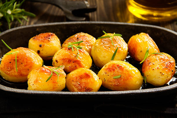 istock Baked potatoes with rosemary. 465884130