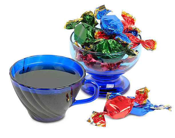 istock Chocolates and cup of tea on a white background 465885499