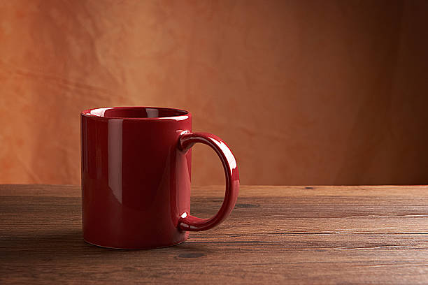 istock Red mug on wooden tabletop 465885691