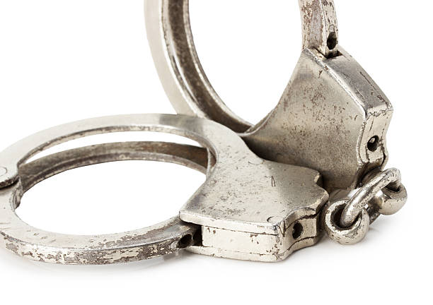 istock retro handcuffs isolated on the white background 465887284