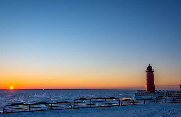 istock Lighthouse on Lake Michigan at Sunrise in Winter 465890220