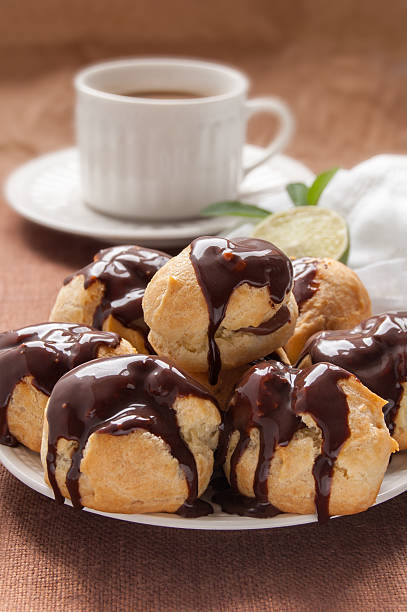 istock Homemade profiteroles with chocolate cream 465891715