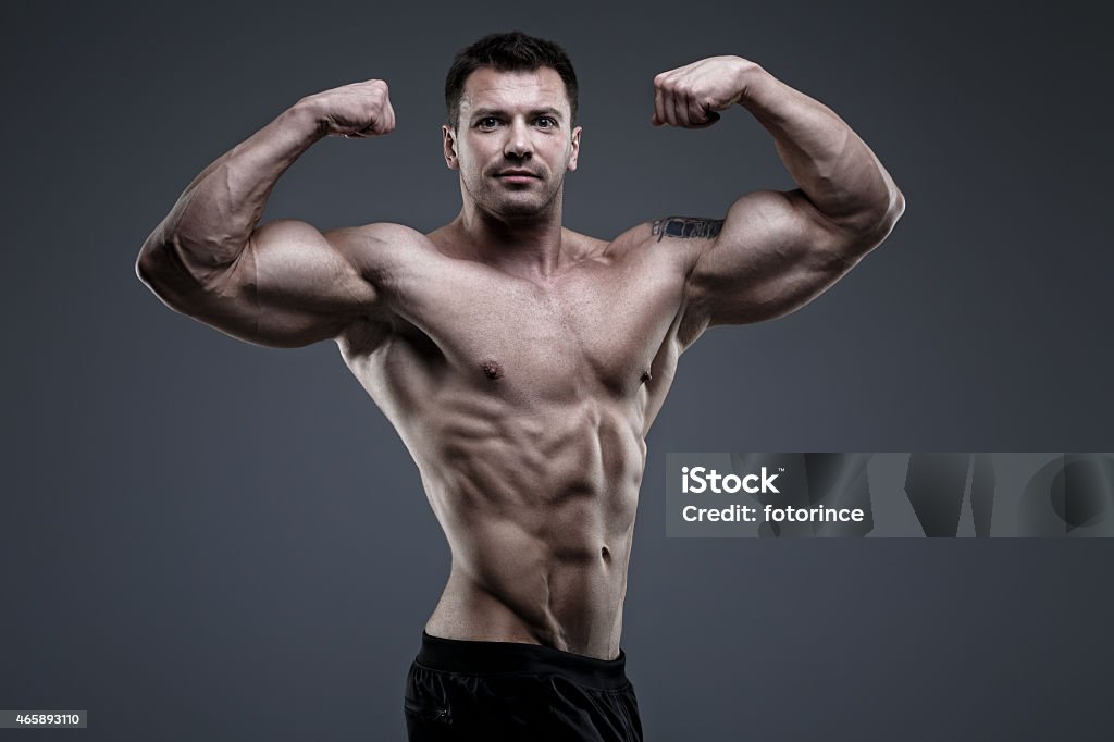 Bodybuilder P Handsome Bodybuilder Posing In The Studio Stock Photo - Download Image ...