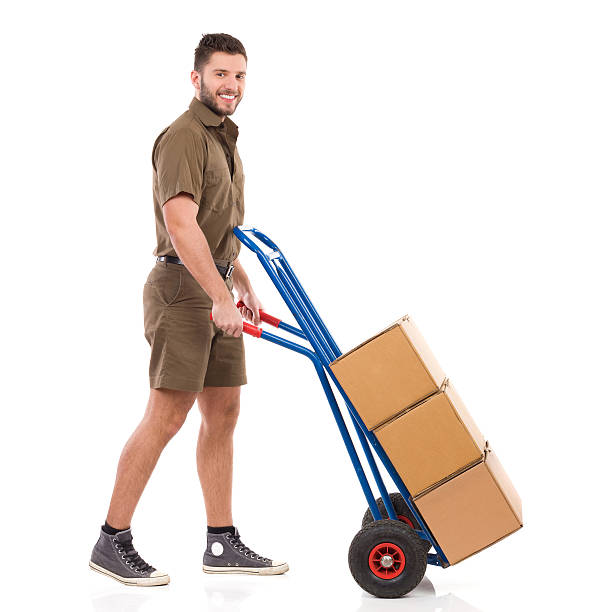 istock Messenger walking with a delivery cart 465893768