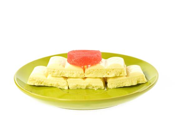 istock Green plate white chocolate red jujube 465894198