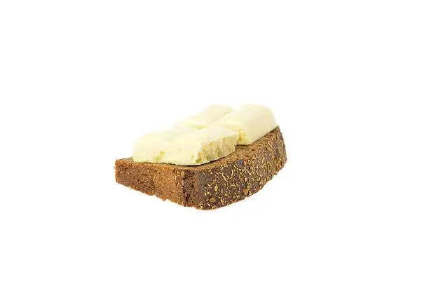 Piece of fresh bread Borodino white chocolate on a white background