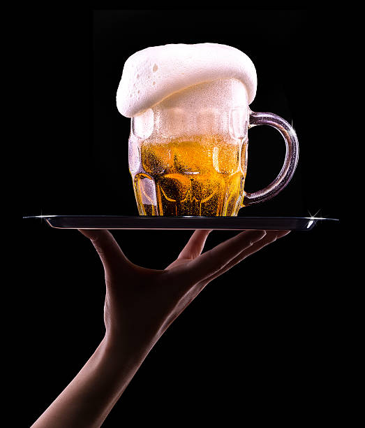 istock Beer into glass on a black 465894567