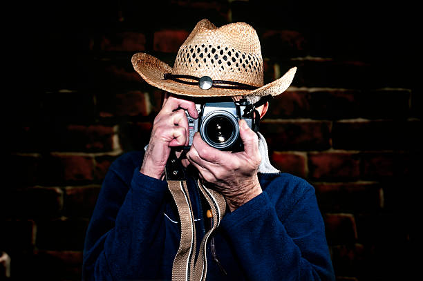 istock Man photographing with vintage film camera 465896161