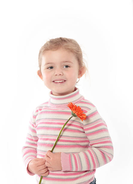 istock Little Girl Holding A Flower 465896853