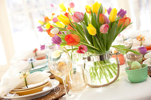 istock Easter dining table, bouquet of tulips and lovely place setting 465897228