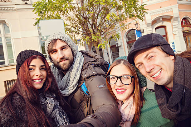 istock Group Of Tourists Taking Selfie 465897524