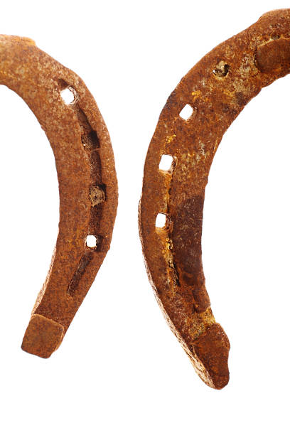 istock Rusty horse shoes on qhite 465898280