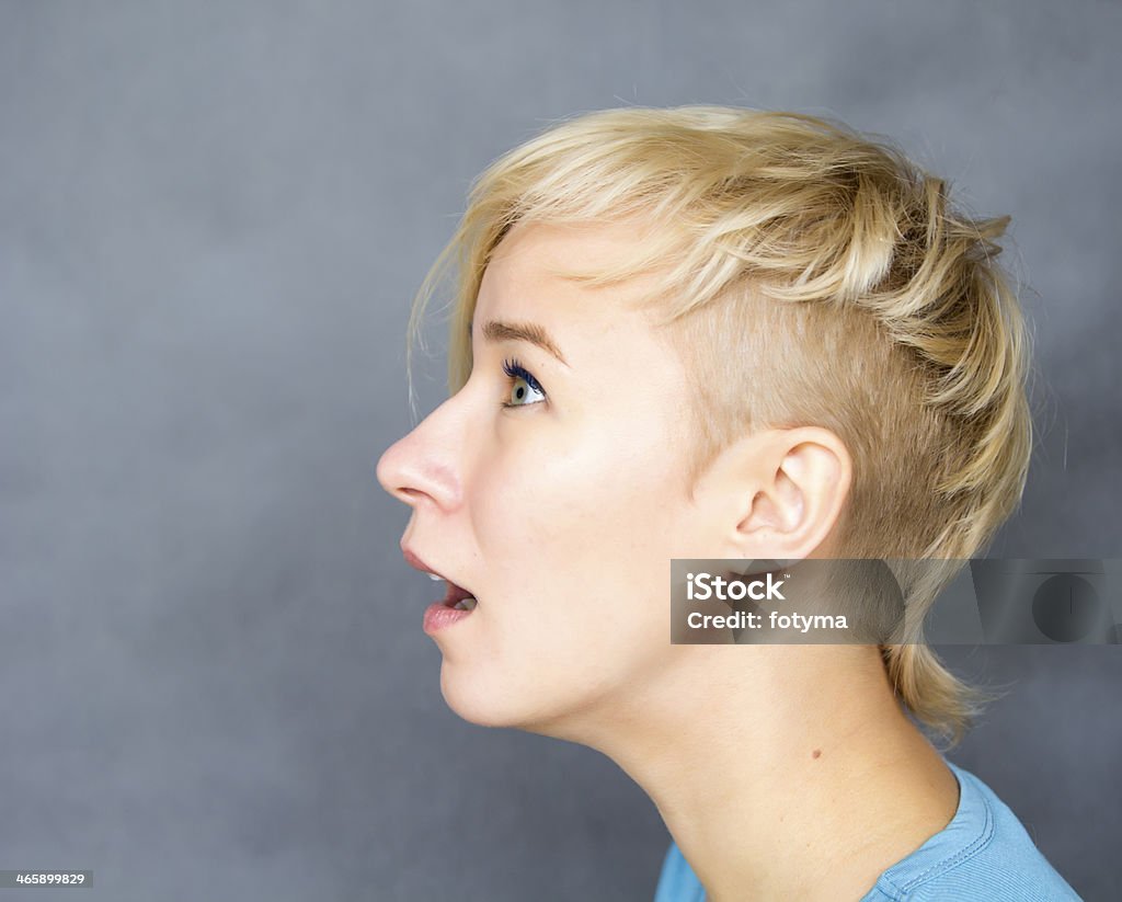 looking above portrait of young blond woman looking above Above Stock Photo