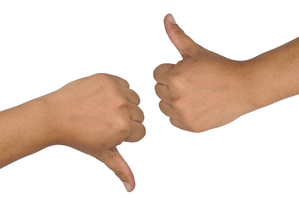 istock man hand showing thumb up and down isolated white background 465900918