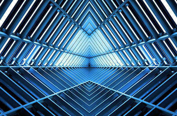 metall-struktur ähnlich wie raumschiff interieur in blau licht - eingangshalle wohngebäude innenansicht stock-fotos und bilder