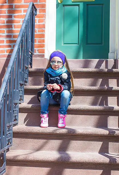 Photo of Little girl in historic district of West Village