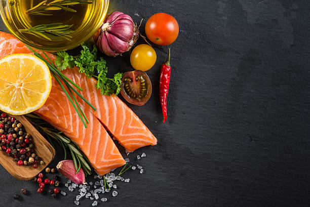 istock Portion of fresh salmon with spices,herbs and vegetables 465902248