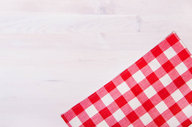 istock red checkered napkin on wooden background 465902712