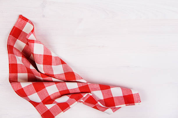istock Red checkered napkin against white background 465902716