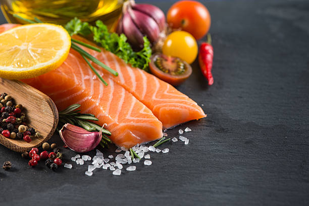 istock Portion of fresh salmon with spices,herbs and vegetables 465902986