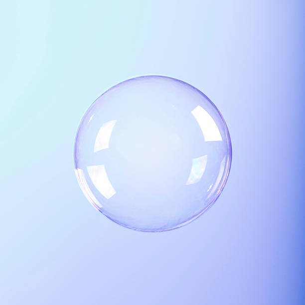 istock A clear round soap bubble on a bluish-purple background 465904317