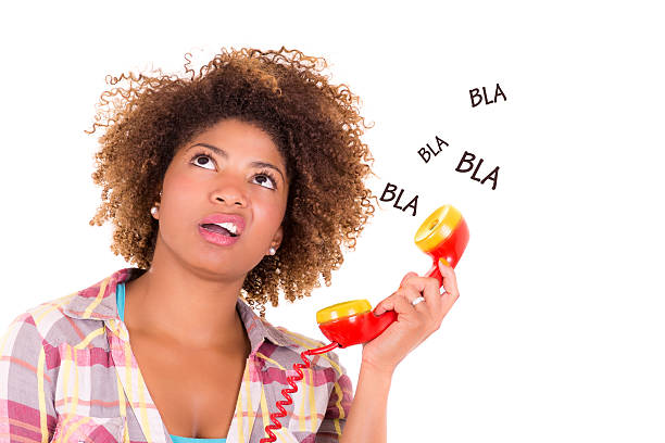 Afro-American young woman answering a call, isolated on white background