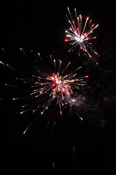 istock Cluster of colourful fireworks against dark sky 465907438