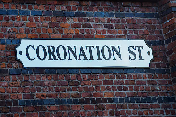 Coronation street tour sign Manchester, United Kingdom - October 4, 2014: This is the sign outside the Coronation Street Tour in Manchester giving directions to the old Granada studios, it is on public roads and is not necessary to have bought tickets to see this sign. itv photos stock pictures, royalty-free photos & images