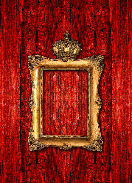 istock Baroque golden frame over red wooden background 465911088