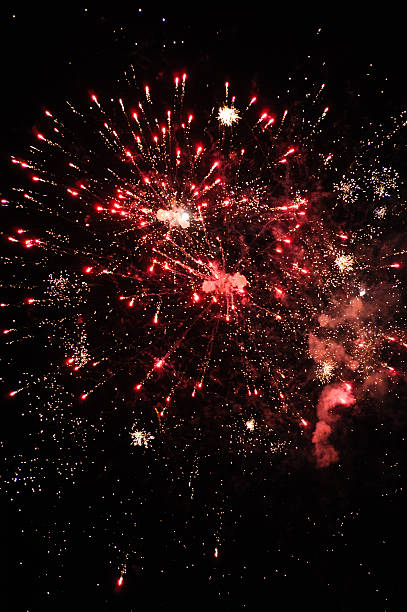 istock Cluster of colourful fireworks against dark sky 465911560