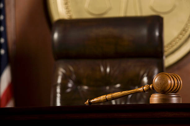 istock Judges chair with wooden gavel 465912148