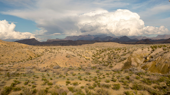 Big Bend National Park in browns, blues, purples with clouds